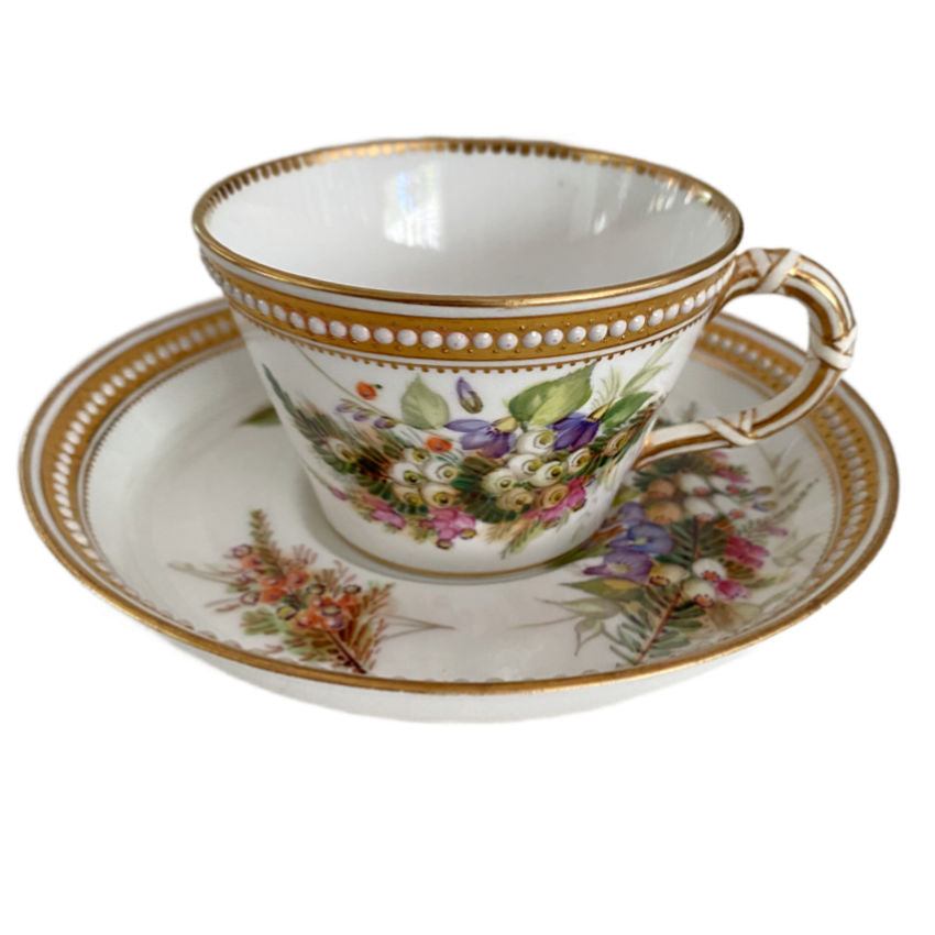 Antique Royal Worcester porcelain tea cup with individually hand-painted flowers, raised jeweled enamel decoration, and elegant gilded details.