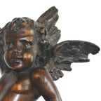Antique pair of Baroque angel figures carved in wood with expressive faces and flowing wings- close up view