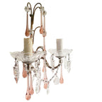 French crystal sconces adding warmth and glow to a refined interior
