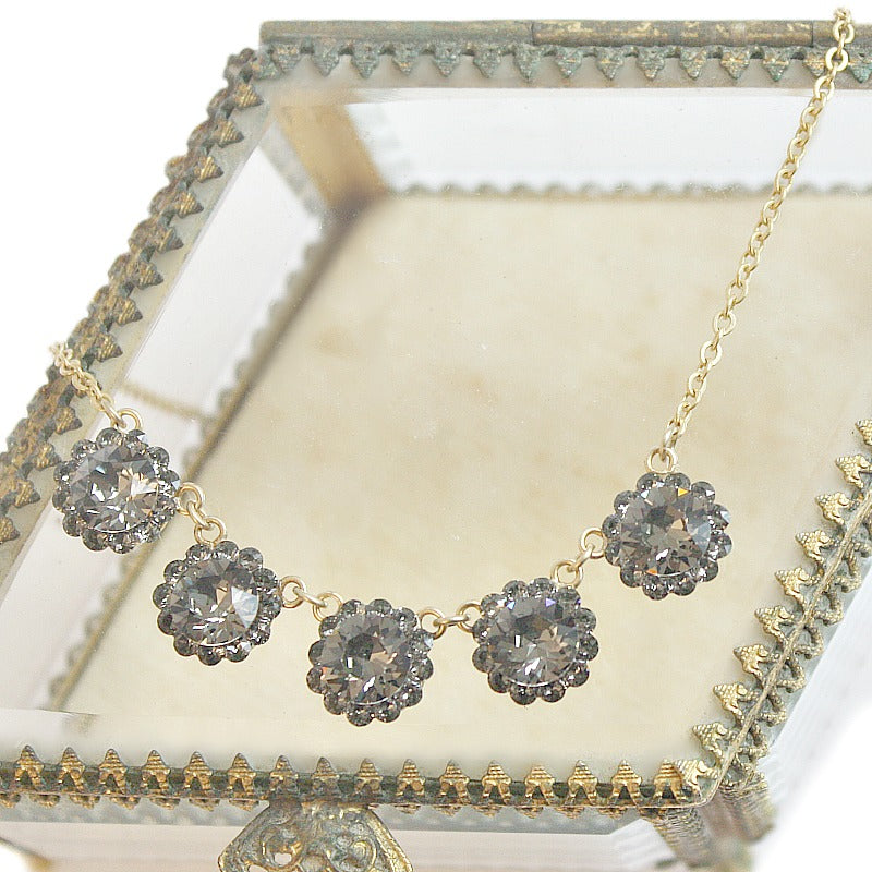 Elegant French necklace with sparkling Swarovski crystals, handmade with classic European findings. Timeless Parisian charm and craftsmanship.
