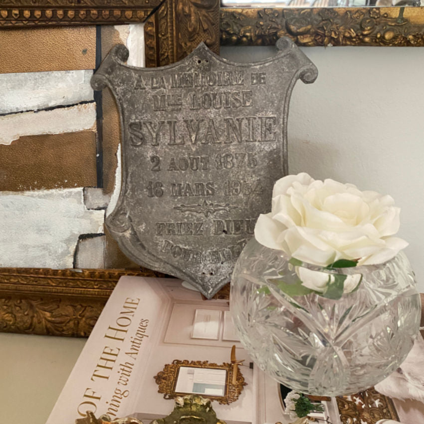 French cemetery memorial plaque displayed indoors as decorative collectible with vintage décor accents