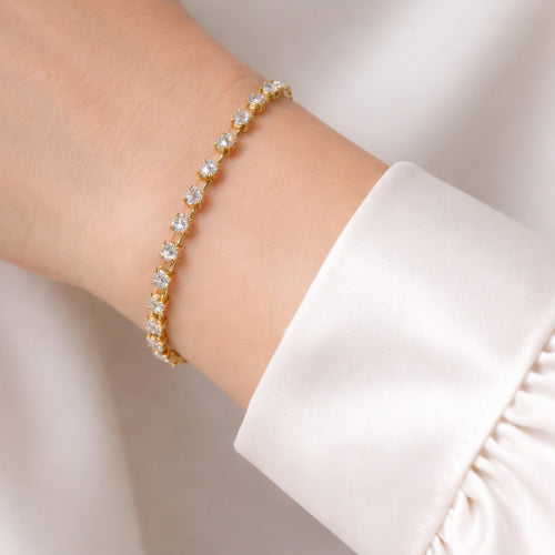 Timeless French gold bracelet with cushion-cut Parisian Clear Swarovski crystals, expertly made from antique molds, luxe dangle. Elegant, collectible, and refined.