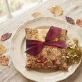 Autumn rose lavender sachet displayed in an antique French plate with hydrangeas and leaves