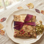 Autumn rose lavender sachet displayed in an antique French plate with hydrangeas and leaves