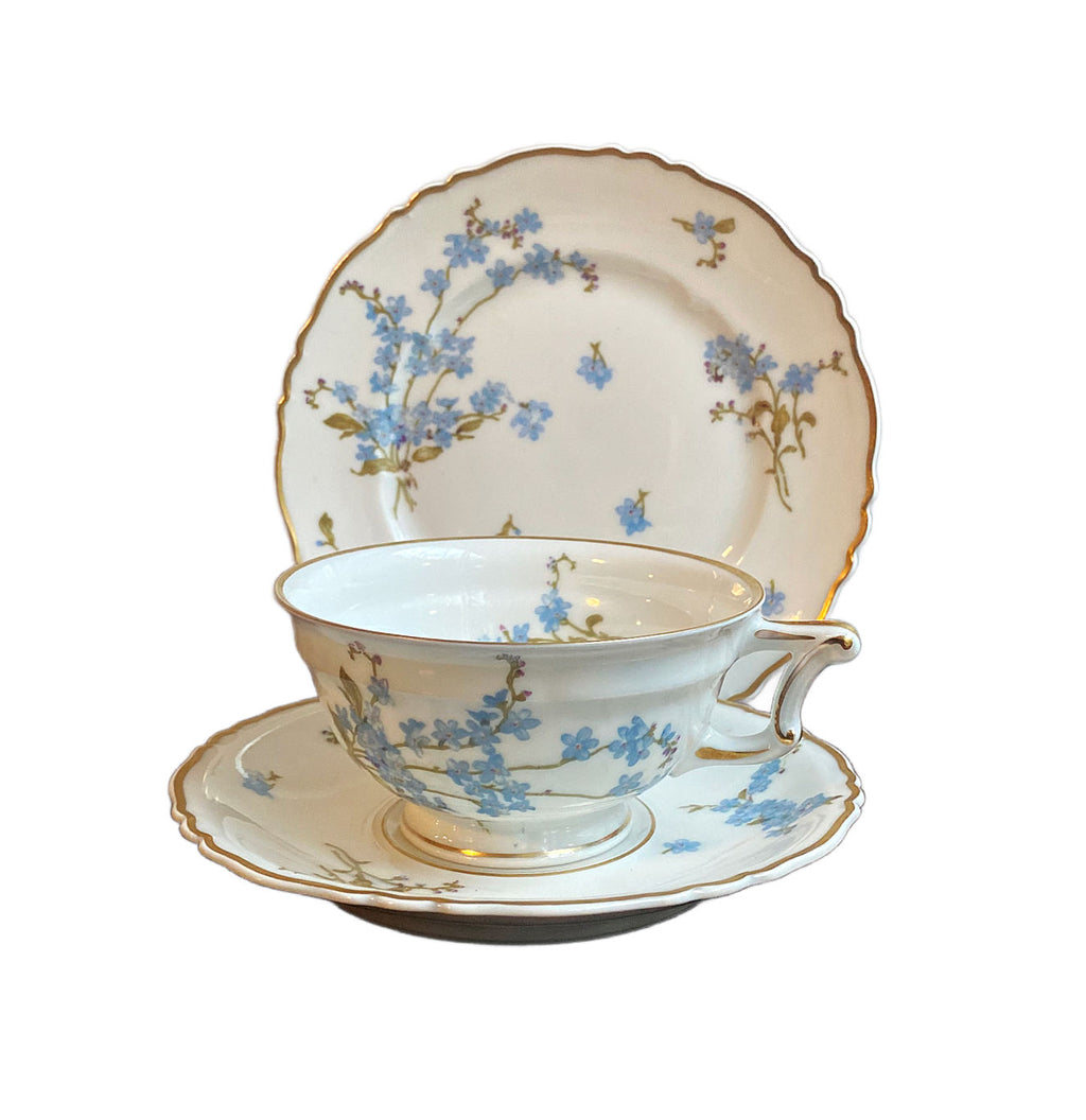 Early 20th century Haviland Limoges Montméry tea trio with blue forget-me-not florals and softly scalloped gilt edges.