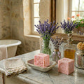 Marseille handmade rose soap cubes dried petals in French Country bathroomwith lavender in vases