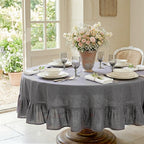 Neutral grey linen table setting styled for refined European dining aesthetic