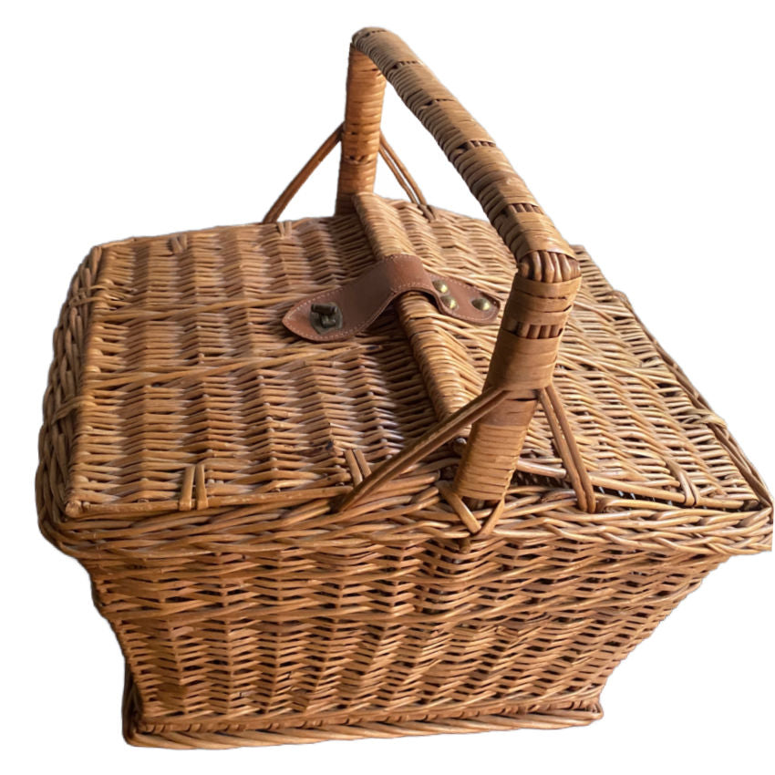 Rustic French willow basket with handle, two openings, and leather strap closure