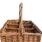 close detail of braided willow compartments and thick handle  in antique French handwoven wine carrier