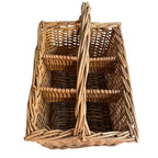 top view of french country vineyard basket holding wine bottles in warm natural light