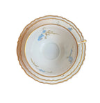 Early 20th century Haviland Limoges Montméry tea trio with blue forget-me-not flowers and softly scalloped gilt edges.