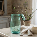 Antique French aqua preserving jar displayed on a collected French Country kitchen counter