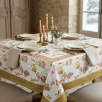 French winter hares hand-printed cotton tablecloth set on a french country table