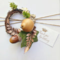 Gold twine gift wrap set with little cards and a wreath with a pear and bronze ferns
