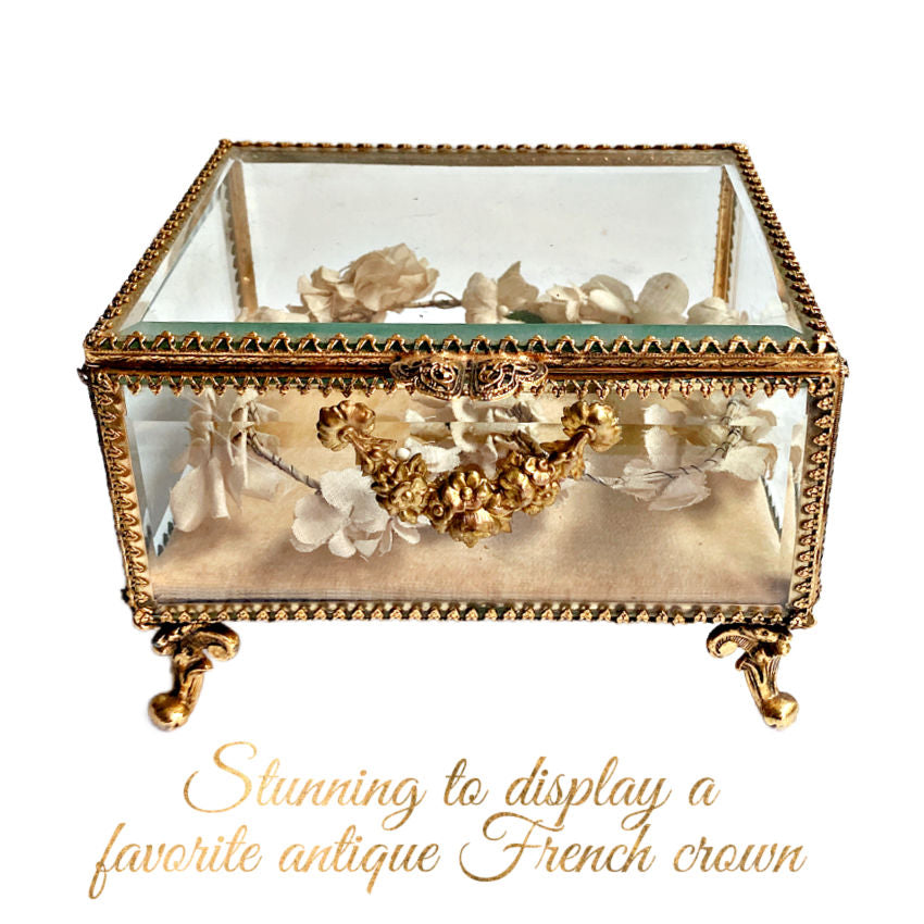 antique French gilt jewelry box casket with rose garland, rococo feet and an antique French floral crown inside.