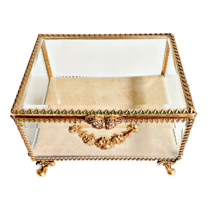 Glt jewelry casket featuring heavy beveled glass panels, Rococo-style feet, and delicate rose garland detailing, and the original cushion. A luxurious collector’s gem, perfect for keepsakes or jewelry displays showing top view.
