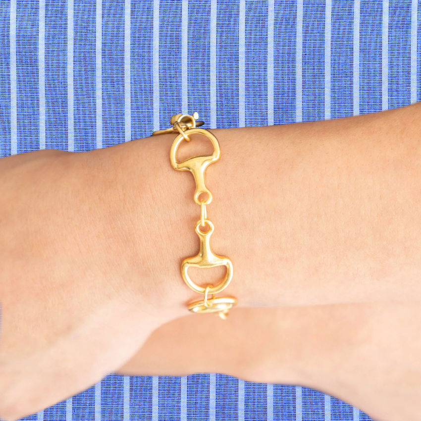 Hand cast with triple plated 24 kt gold bracelet with links, toggle closure.