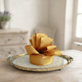 Golden Glow Satin French Wired Ribbon in French country living room on antiqu gold tray