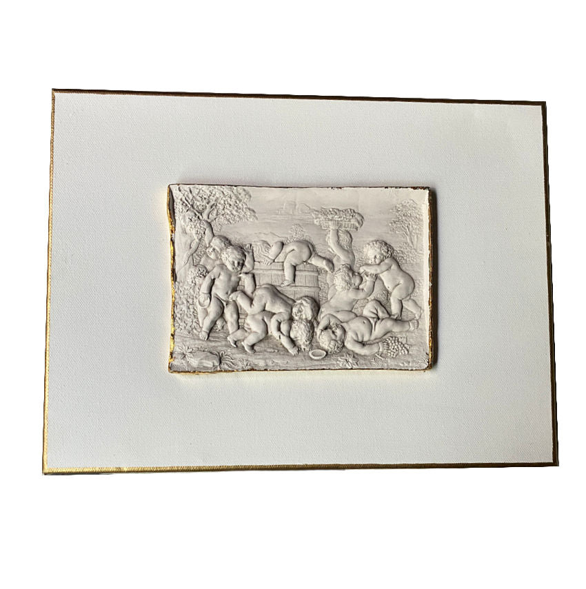 Grand Tour cherub relief mounted on canvas with gilt edge detail