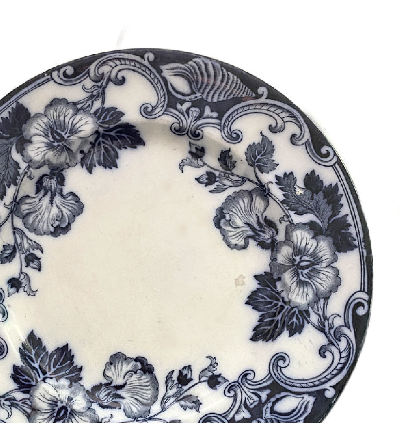 Antique 19th century Flow Blue “Althea” hibiscus floral plate by Hill Pottery, with Bellino &amp; Fenderich Odessa mark and rich cobalt color.