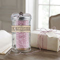 La Favorite metallic rose and white baker's twine in glass dispenser in French country office