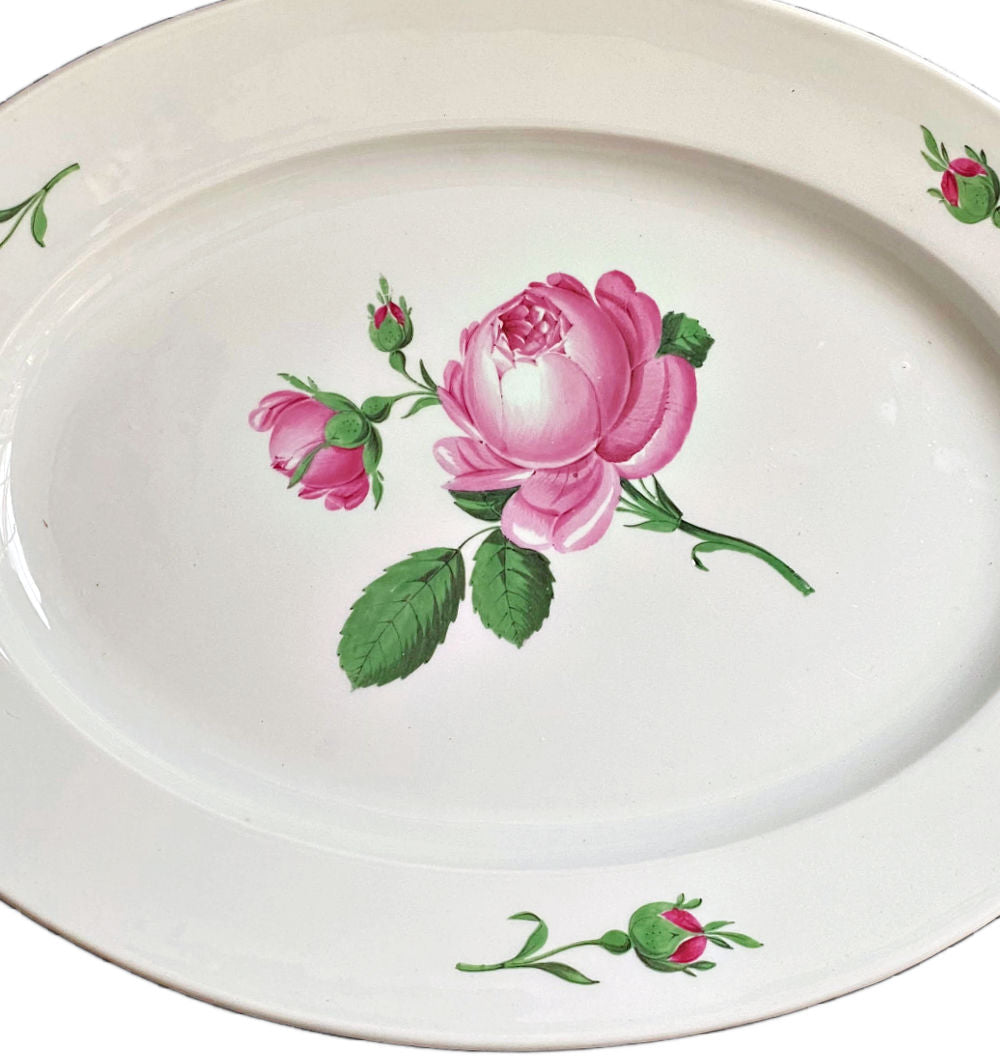 Antique Meissen hand-painted porcelain serving dish with a central pink rose design and green leaves on a white background, surrounded by a scalloped edge.