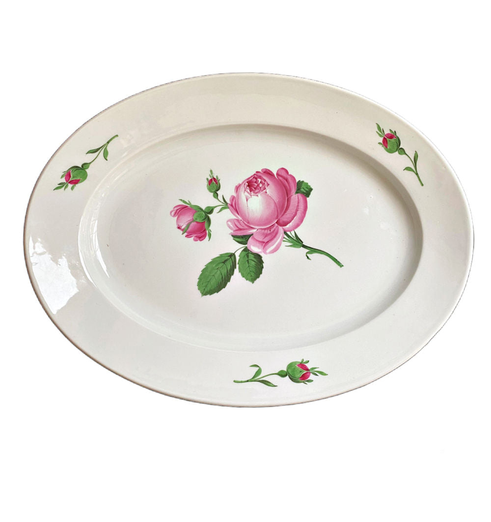 Antique Meissen hand-painted porcelain serving dish with a central pink rose design and green leaves on a white background, surrounded by a scalloped edge.