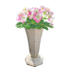 Decorative French cast iron urn with cream enamel, large collectible vase-sized piece with pink flowers