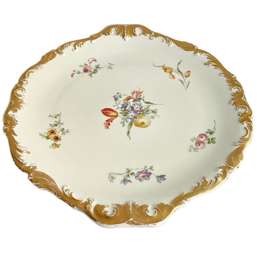 Antique Limoges serving platter by Tressemann & Vogt  hand-painted florals with ornate scalloped gilt rim in side view