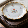Antique Limoges hand-painted porcelain serving platter with scalloped gilt rim on French tab;e with linen cloth