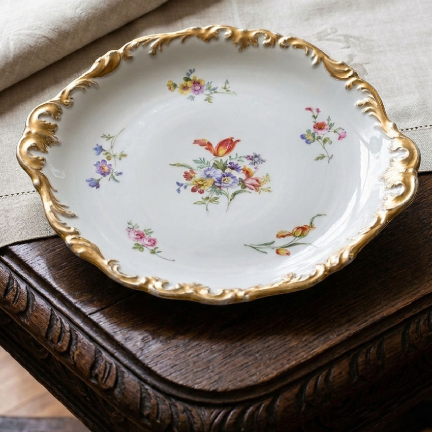 Antique Limoges hand-painted porcelain serving platter with scalloped gilt rim on French tab;e with linen cloth
