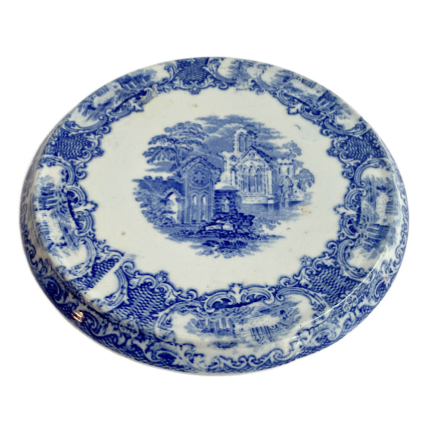 Late 19th century Petrus Regout blue and white transferware tea trivet in perfect condition. Crisp pastoral scene and classic Victorian charm.
