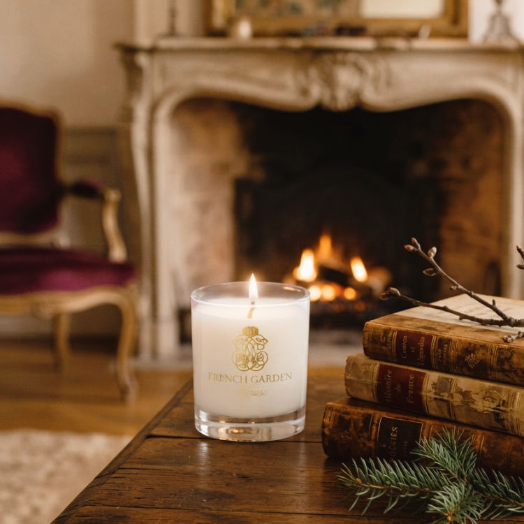 Les Bois luxury French candle glowing in an elegant French country room with fireplace
