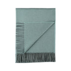 Indulge in this handwoven Celadon Mist alpaca throw, crafted from the finest baby alpaca for unmatched softness, warmth, and timeless sophistication.