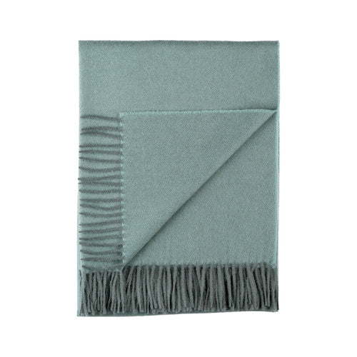 Indulge in this handwoven Celadon Mist alpaca throw, crafted from the finest baby alpaca for unmatched softness, warmth, and timeless sophistication.