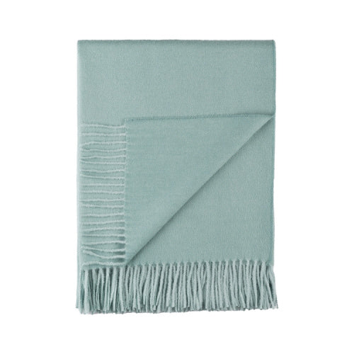 Indulge in this handwoven Sea Glass alpaca throw, crafted from the finest baby alpaca for unmatched softness, warmth, and timeless sophistication.