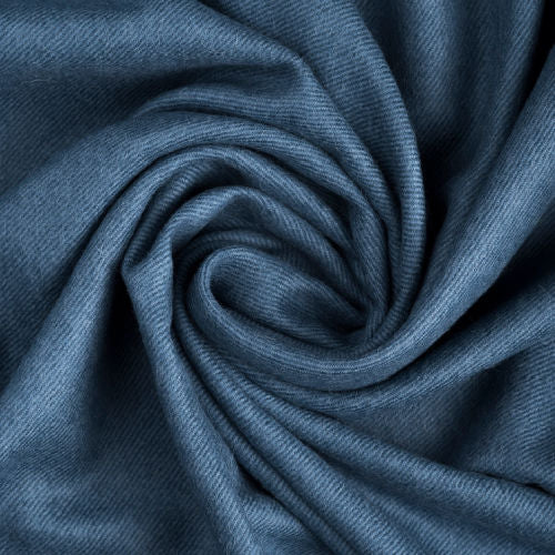 Indulge in this handwoven Slate Indigo alpaca throw, crafted from the finest baby alpaca for unmatched softness, warmth, and timeless sophistication.