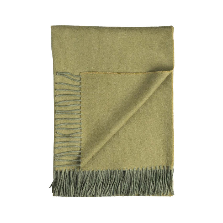 Luxurious soft green alpaca throw with fringes 