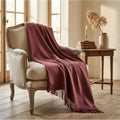 Handwoven baby alpaca throw draped over antique French fauteuil