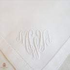 close up of bourdon embroidery on antique linen napkin