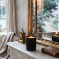 Noël en Fleurs luxury candle glowing on a marble mantel in an elegant French-inspired winter interior