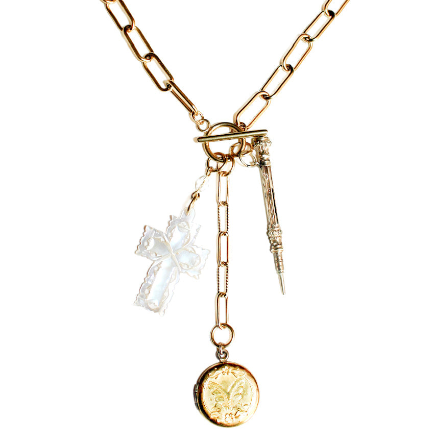 Antique gold filled locket necklace with a Victorian chatelaine pencil and a carved mother-of-pearl cross on a paper clip chain.