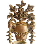 Ornate rose and rams heas garland detail on antique bronze wall sconces