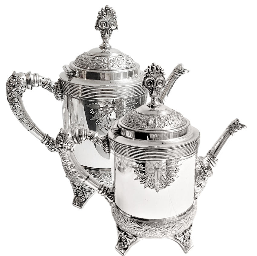 Pair of ornate antique Meriden Britannia silver plated teapots, richly detailed with Victorian repoussé and engraved designs. Elegant display pieces for your home.