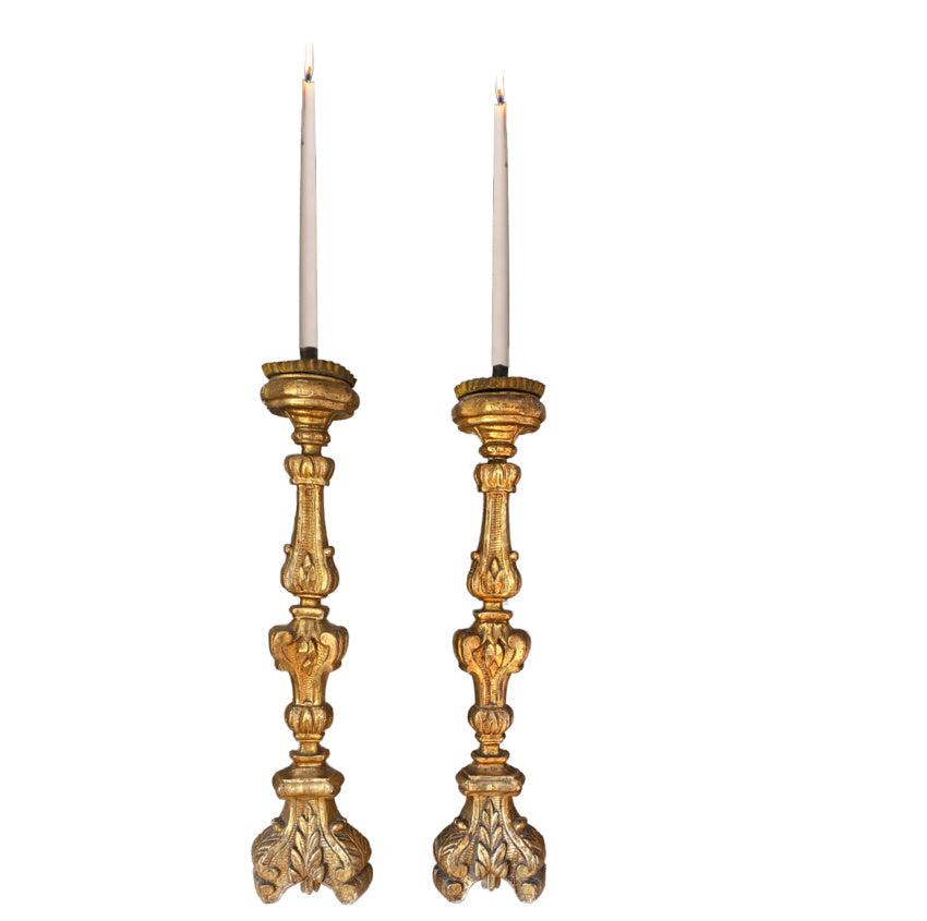 Large 19th-century French gilt altar candlesticks in complementary sizes with gilded fronts. Elegant and luminous, perfect for mantels or luxury interiors.
