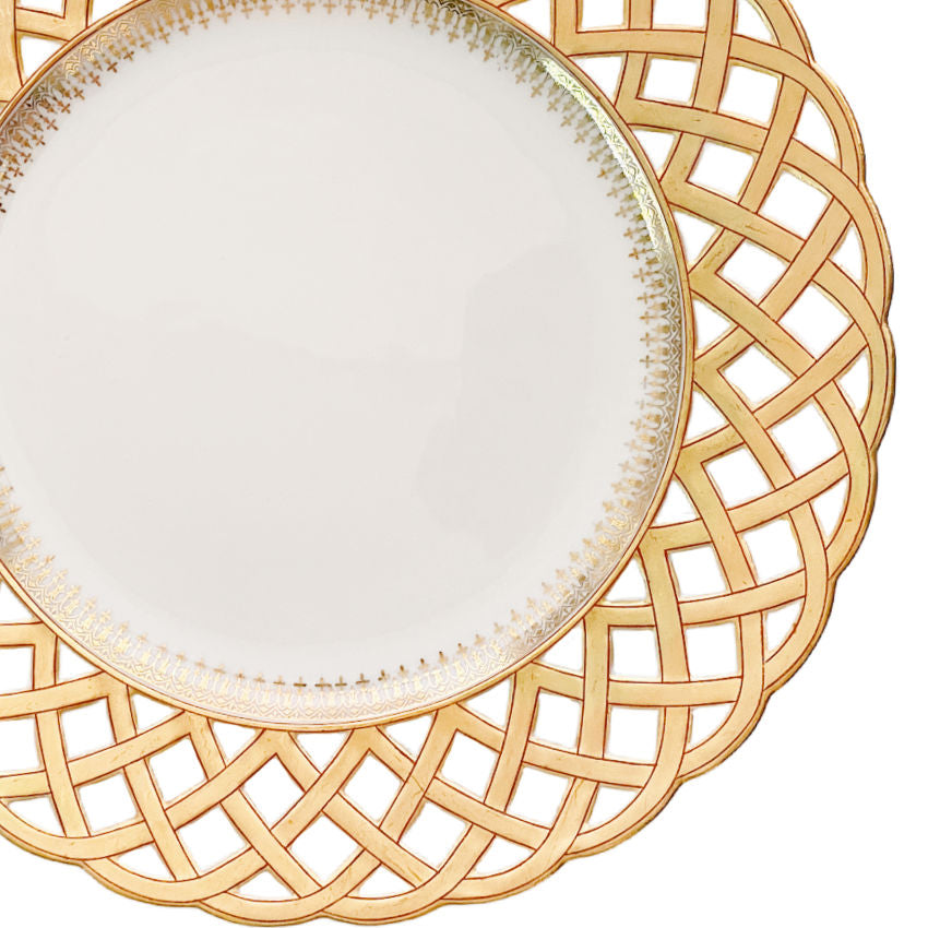 Close-up of intricate porcelaine ajourée openwork on an antique Pillivuyt French porcelain plate