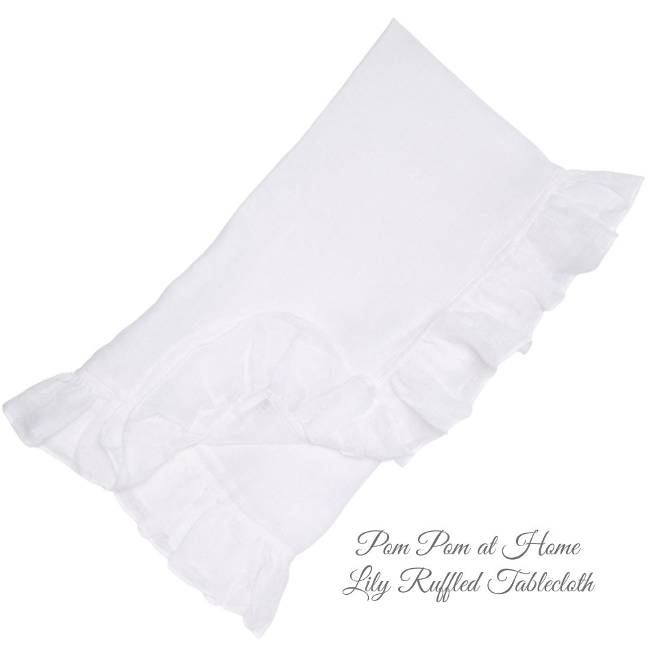Organic white linen tablecloth with soft 4-inch ruffle edge detail