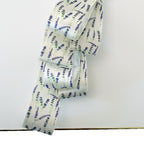 White satin ribbon embellished with lavender flowers for luxury gift wrapping