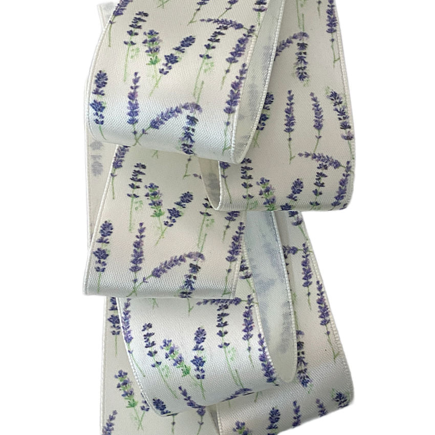Provence lavender satin ribbon in white with scattered lavender all over.