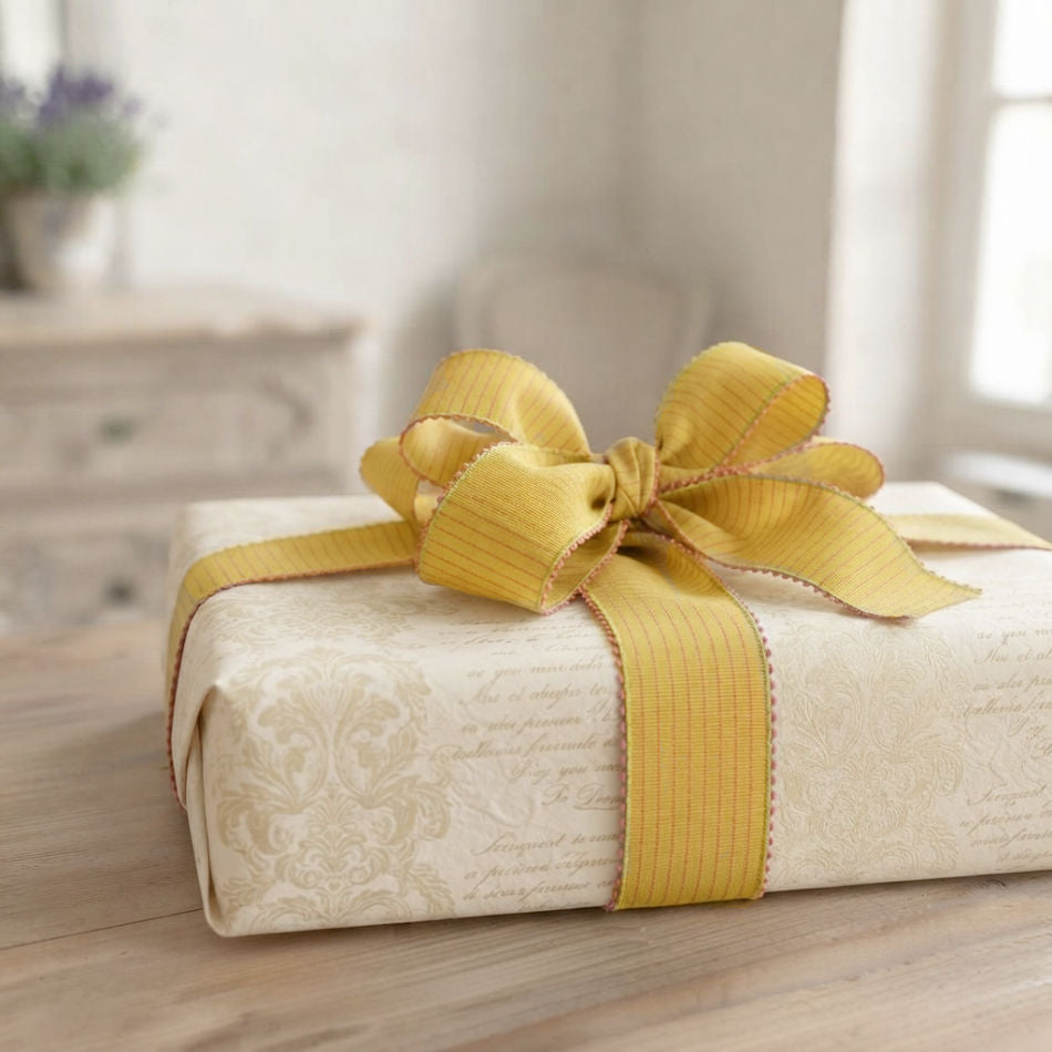 Provence Piquot French wired ribbon in a bow on a beautifully wrapped French gift
